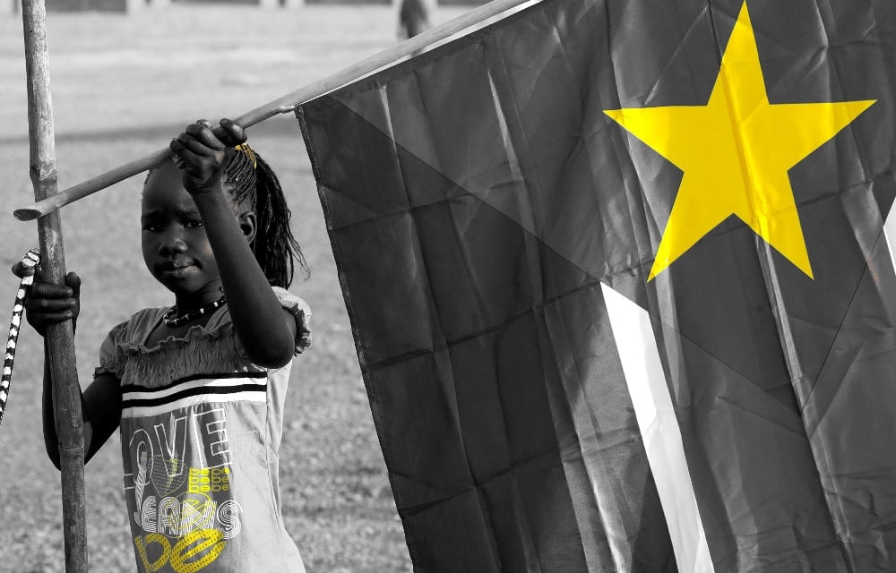 Girl with Sudanese flag