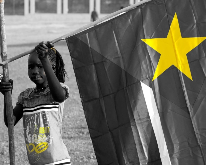 Girl with Sudanese flag