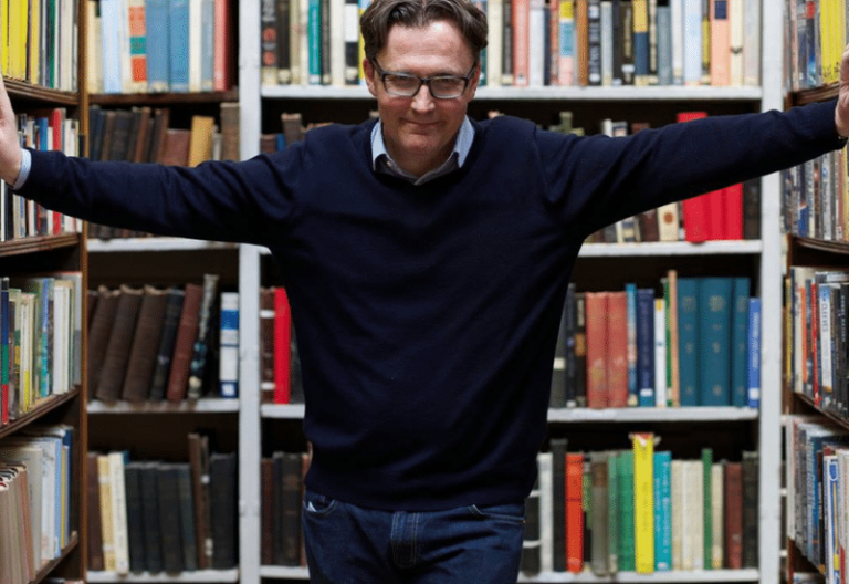 Author William Ryan in a library