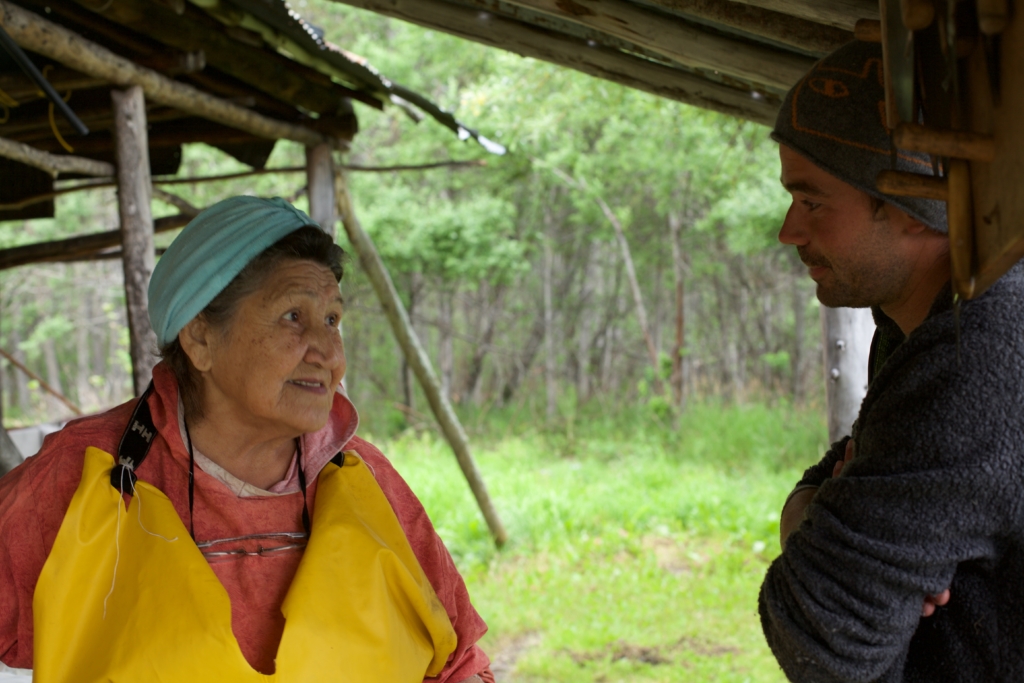 Adam Weymouth in discussion with Mary Demientieff, an Athabascan elder. Photo by Ulli Mattsson