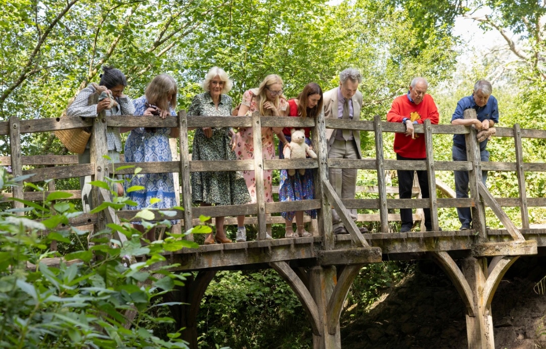 children’s authors Dame Julia Donaldson, Axel Scheffler, Cerrie Burnell, Jane Riordan, RLF Fellow, Sita Brahmachari with Her Majesty The Queen, RLF Chief Executive Edward Kemp and event host Giles Brandreth play Pooh Sticks in Ashdown Forest