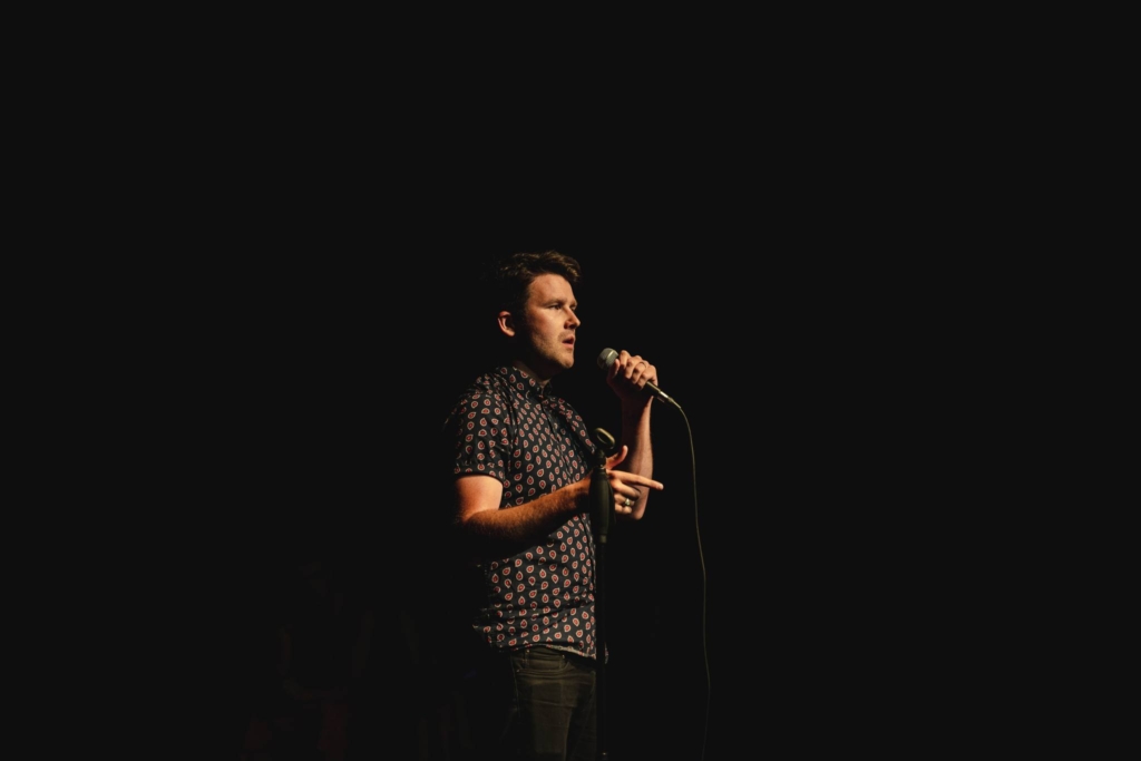 Matt Abbott performing poetry onstage